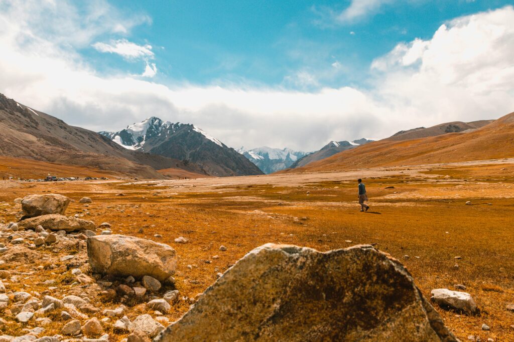 Explore the vast and scenic mountain landscapes with snowy peaks in Pakistan.