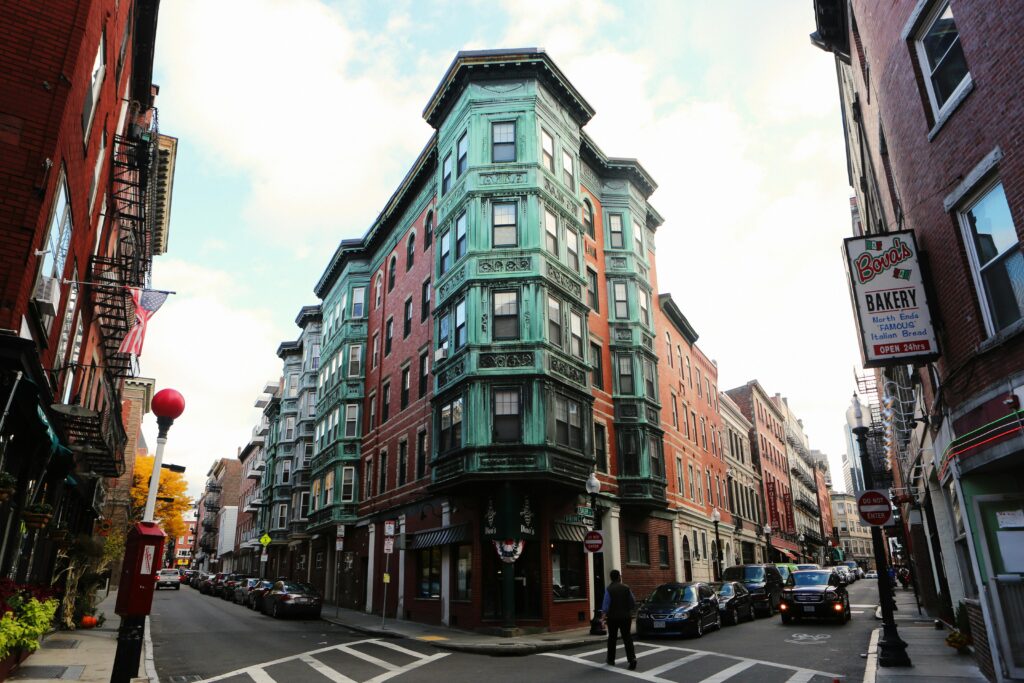 Charming street corner with vintage buildings in a bustling city scene.